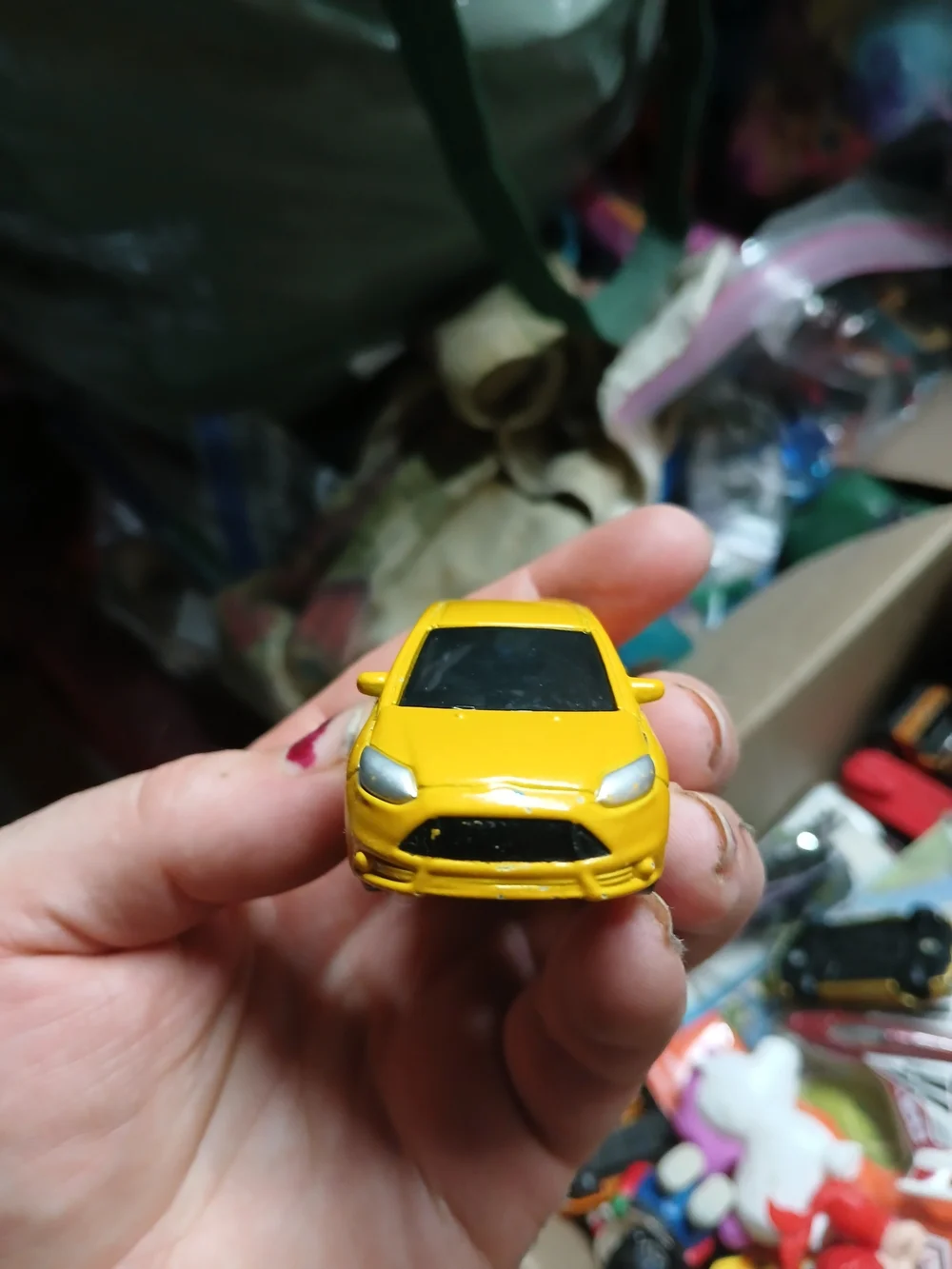 yellow 1:64 scale Maisto Ford Focus ST die-cast toy car